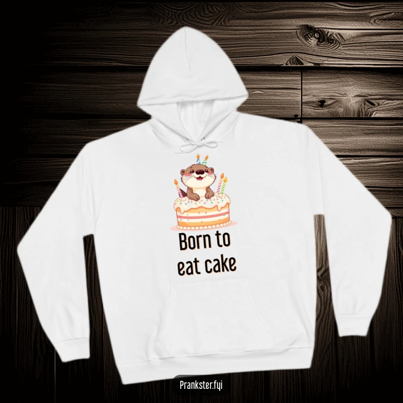 Funny hoodie featuring a giggling otter popping enthusiastically out of a delicious-looking birthday cake.