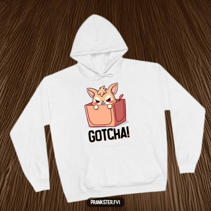 Funny hoodie with a mischievous animal character peeking from a jack-in-the-box, ready to surprise with a wicked grin.